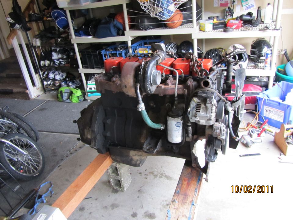 Engine parts and tools on a workbench