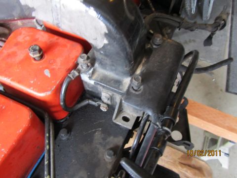 1984 Ford Bronco - Close-up view of engine parts, including orange fluid reservoirs and black hoses, with a date stamp of 10/02/2011.