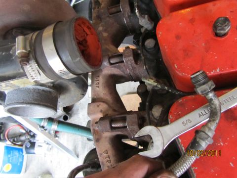 1984 Ford Bronco - A wrench is used on engine parts, with a date stamp of 10/02/2011.