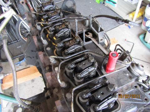 1984 Ford Bronco - Close-up view of an engine's internal components, including the valve train and fuel injection lines.