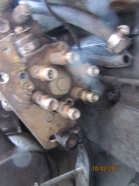 1984 Ford Bronco - Close-up view of a diesel injection pump with multiple fuel lines attached.