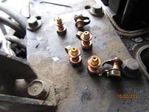 1984 Ford Bronco - Engine terminal bolts with copper washers are visible in this close-up shot.