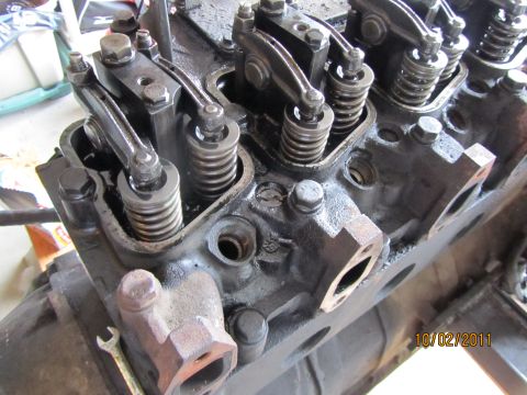 1984 Ford Bronco - Close-up view of an engine's valve train, showing rocker arms and springs.