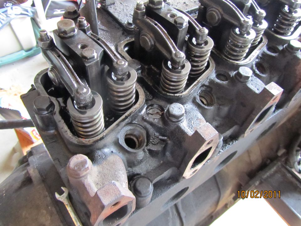 Engine valve train with rocker arms and springs