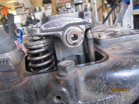 1984 Ford Bronco - Close-up view of an engine's valve spring and rocker arm mechanism.