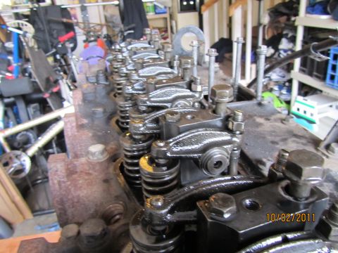 1984 Ford Bronco - Close-up view of an engine's valve train, showing the rocker arms and springs, with a date stamp of 10/02/2011 visible.