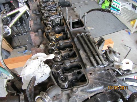 1984 Ford Bronco - Close-up of an engine block's valve train, showing internal components and exposed parts.