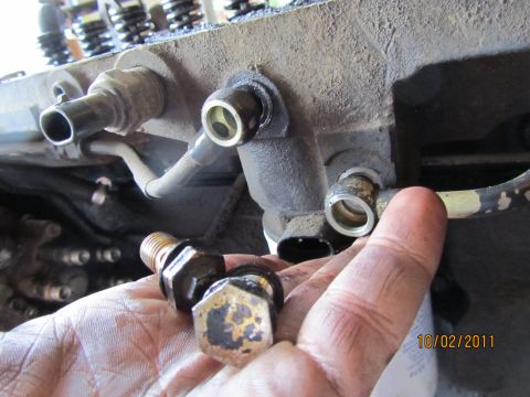 1984 Ford Bronco - Close-up of engine components and fasteners, with a date stamp of 10/02/2011.