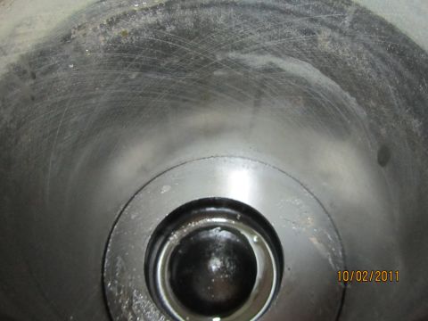 1984 Ford Bronco - Close-up view of an engine cylinder, showing wear marks and a valve mechanism.