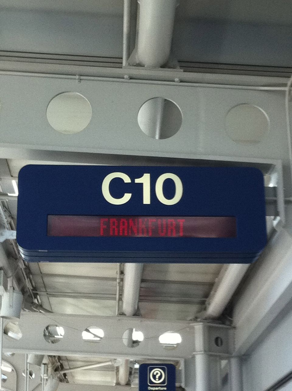 Digital sign shows gate C10 and destination Frankfurt