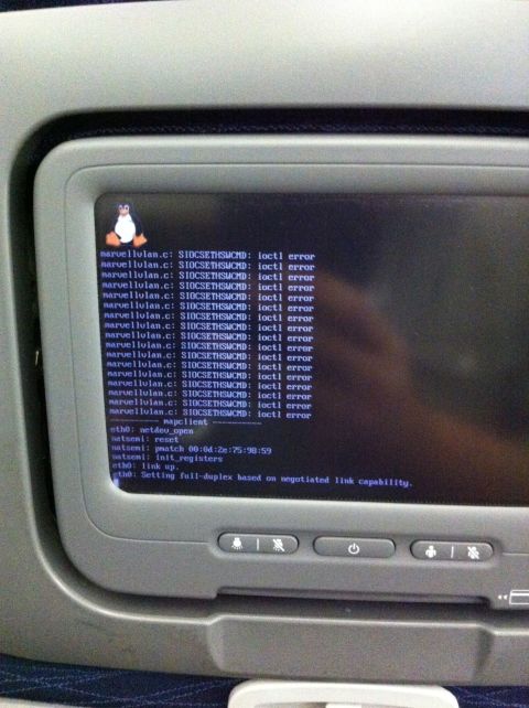 1987 Suzuki Samurai - An in-flight entertainment system displays numerous Linux kernel errors and network configuration messages on its screen.
