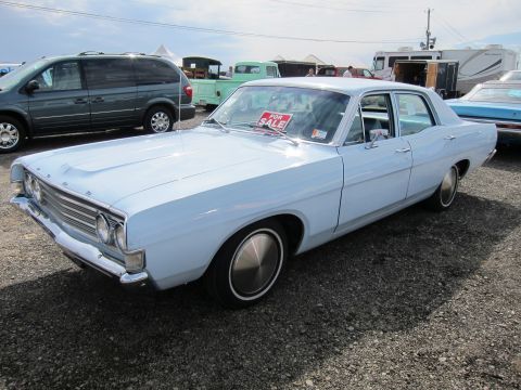 1991 Ford LTD Crown Victoria - Light blue 1968 Ford Torino sedan parked outdoors with a 'FOR SALE' sign on the dashboard.