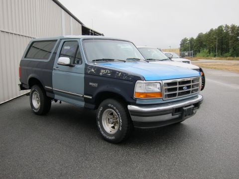 1991 Ford LTD Crown Victoria - This Ford Bronco has a two-tone paint job and appears to be from the early to mid-1990s.