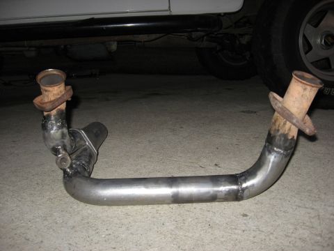1994 Ford Bronco - Custom exhaust pipe section shown with rusty flanges and visible welds.