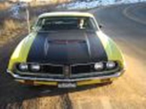 1971 Ford Ranchero - A yellow and black 1970 Ford Ranchero is seen from the front on a paved road.