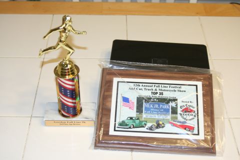 1976 Ford Ranchero - An award plaque from the 12th Annual Fall Line Festival and Car, Truck & Motorcycle Show displays illustrations of vehicles.