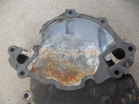 1991 Ford Bronco - This image shows a worn water pump gasket with visible rust and corrosion, indicating potential engine issues.