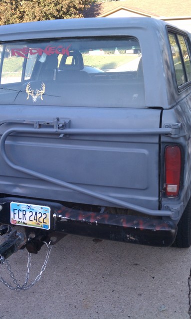 1978 Ford Bronco - The rear of a 1978 Ford Bronco, showing its license plate and a deer skull sticker on the rear window.