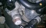 1994 Ford Probe - Engine component detail with attached hoses, likely from a vehicle.