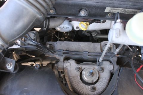 2003 Ford Crown Victoria - Close-up view of an engine bay, showing various mechanical components and wiring harnesses.