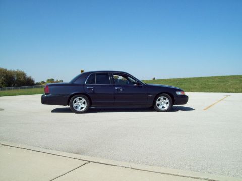 1999 Mercury Grand Marquis - This dark blue 1999 Mercury Grand Marquis is shown from the side on a clear day.