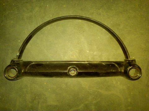 1954 Ford Customline - A black metal dashboard trim piece is shown against a textured background.
