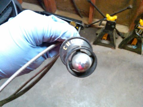 1954 Ford Customline - A gloved hand holds a choke knob with visible text.