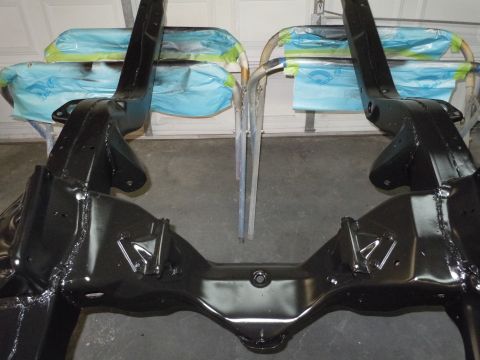 1973 Pontiac Trans Am - Car frame parts are prepared for further work in a garage setting.