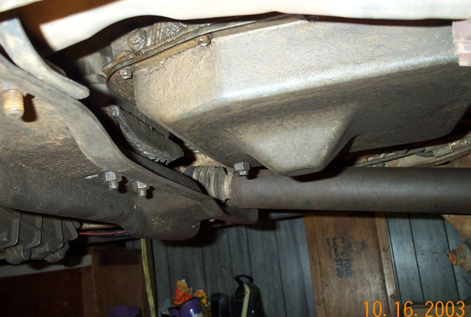 Underside of truck showing transmission pan, driveshaft and axle brackets, dated 2003