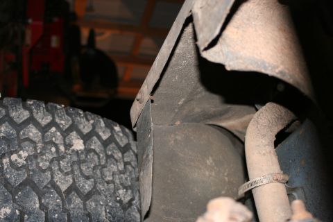 1989 Ford Bronco - Undercarriage view showing a tire and exhaust pipe, with a watermark for Supermotors.net.