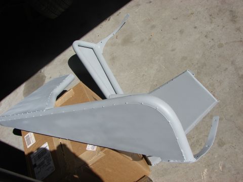 1978 Ford Bronco - Unidentified vehicle body and frame parts are laid out on cardboard boxes.