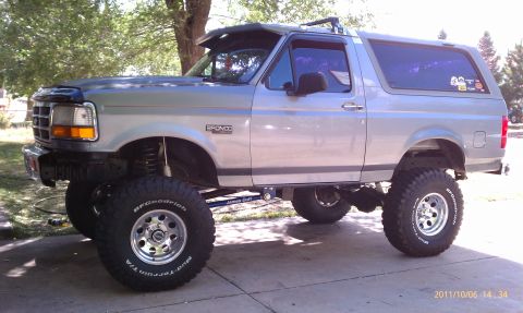 1994 Ford Bronco - This lifted Ford Bronco has a custom suspension and large off-road tires.