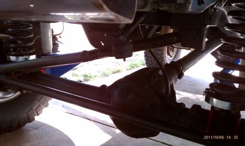 1994 Ford Bronco - Close-up of the suspension and drivetrain components of a 4x4 vehicle.