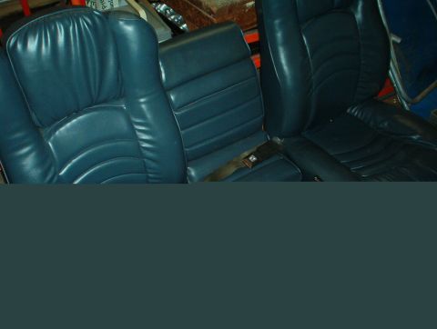 1978 Ford Bronco - The middle seat hides a mini console with storage bin and cupholders.
