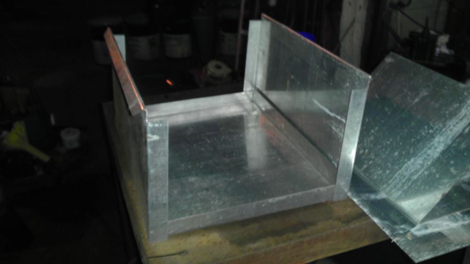 Metal ductwork assembly on a workbench