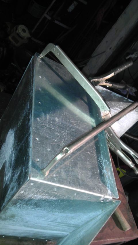 1989 Ford Bronco - A metal box is secured with clamps, suggesting it is part of a fabrication or repair process.