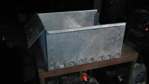 1989 Ford Bronco - A fabricated metal box sits on a table next to a welding machine.