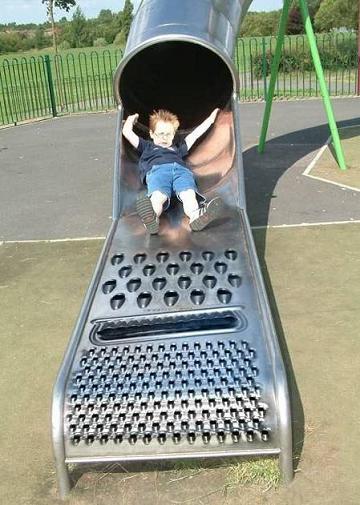1978 Ford F-250 - A child enjoys a slide at a playground, the slide's surface textured like a cheese grater.