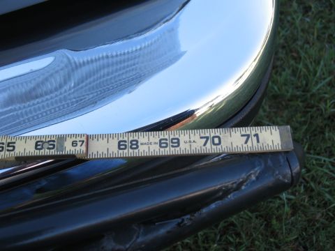 1994 Ford Bronco - A close-up shot shows a chrome bumper and a measuring tape laid across it.