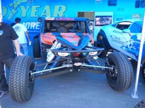 1997 Ford Ranger - An off-road buggy with a distinctive blue and orange paint scheme is displayed, with another vehicle partially visible to the right.