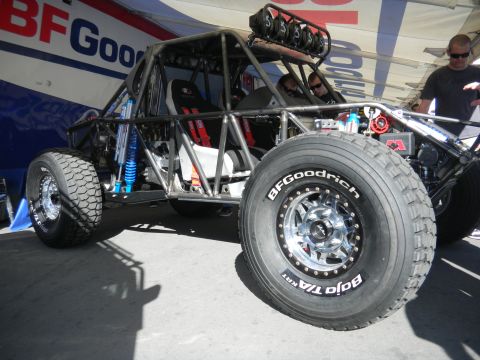 1997 Ford Ranger - Custom off-road buggy with BFGoodrich Baja T/A tires is displayed under a tent.