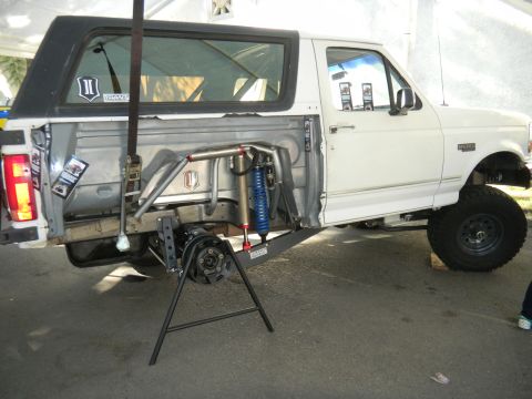 1997 Ford Ranger - This modified Ford Bronco showcases extensive suspension upgrades, including aftermarket shocks and a reinforced frame.