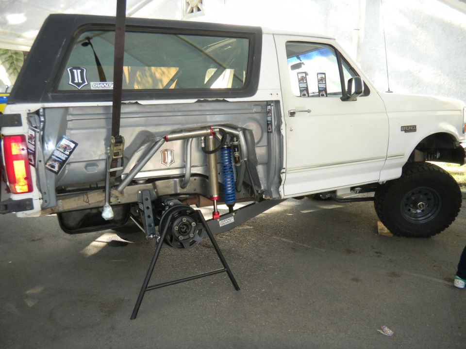 White Ford Bronco side view, custom suspension, off-road modifications
