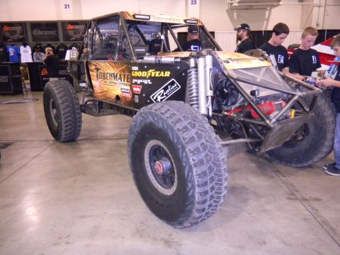 1997 Ford Ranger - Custom off-road buggy with "Torchmate" and "Goodyear" branding is displayed indoors.