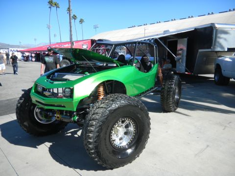1997 Ford Ranger - Custom buggy with oversized tires and exposed engine bay sits outside a trailer.
