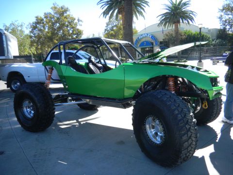 1997 Ford Ranger - This custom buggy features a roll cage and oversized off-road tires, with its hood raised.