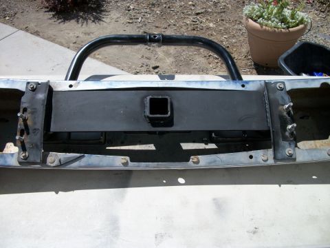 1996 Ford Bronco - Front bumper assembly for a 1992 Ford Bronco, a bull bar and hitch receiver, with chrome trim and off-white paint.