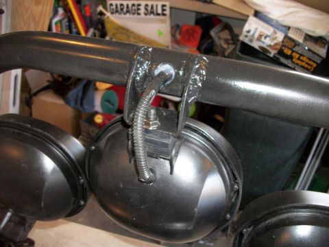 1996 Ford Bronco - Off-road lights are mounted to a bar, with a garage sale sign visible in the background.