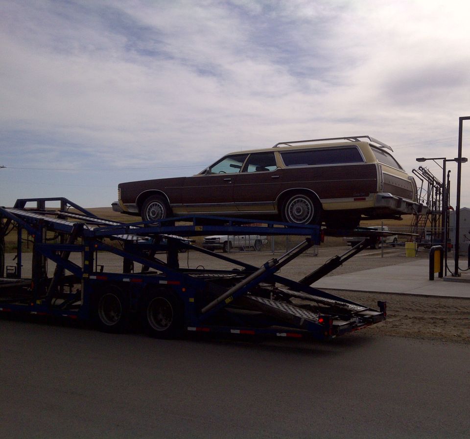 1978 Mercury Colony Park station wagon on a car carrier trailer