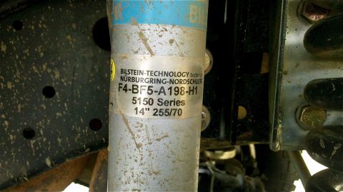 1995 Ford F-150 - Close-up of a Bilstein shock absorber, part number F4-BF5-A198-H1, 5150 Series.